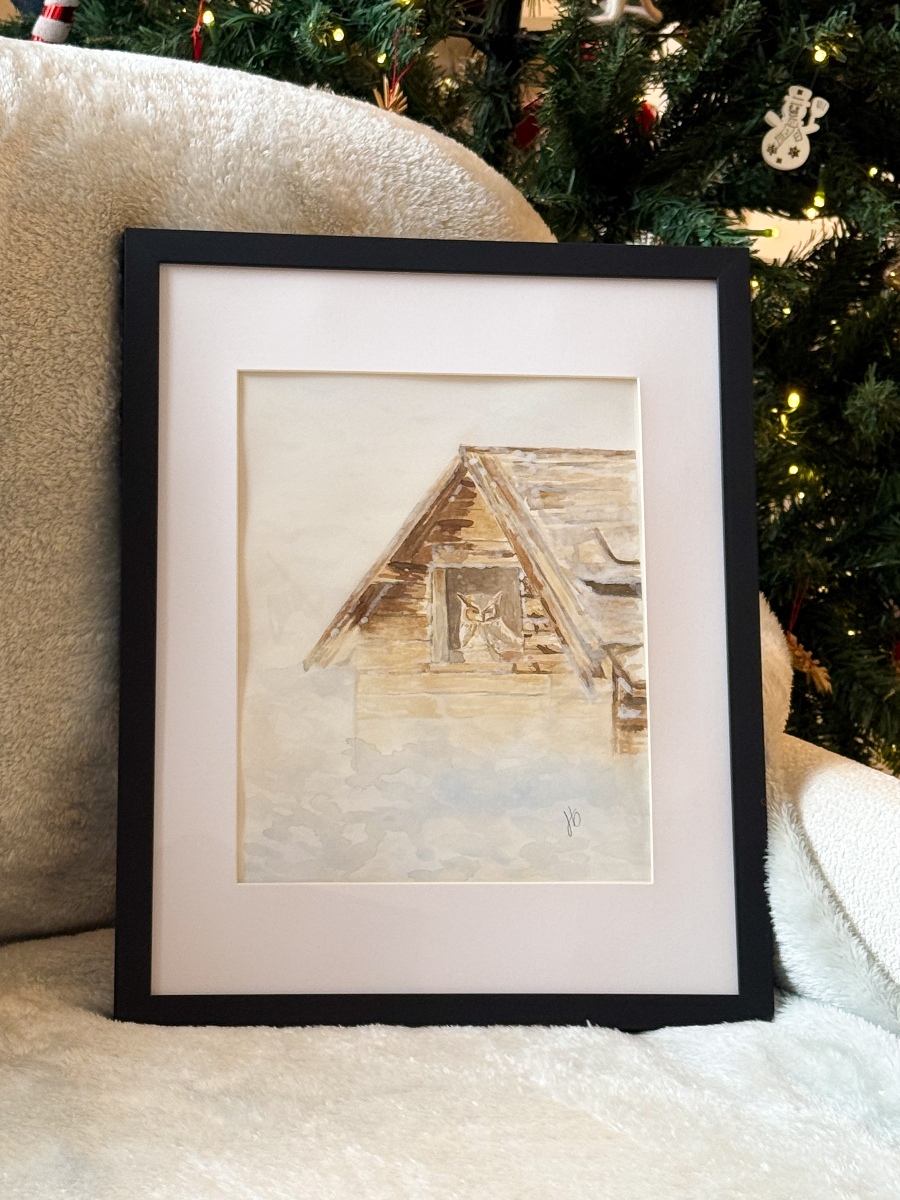 Framed watercolor of an owl perched in the loft window of a weathered wooden barn